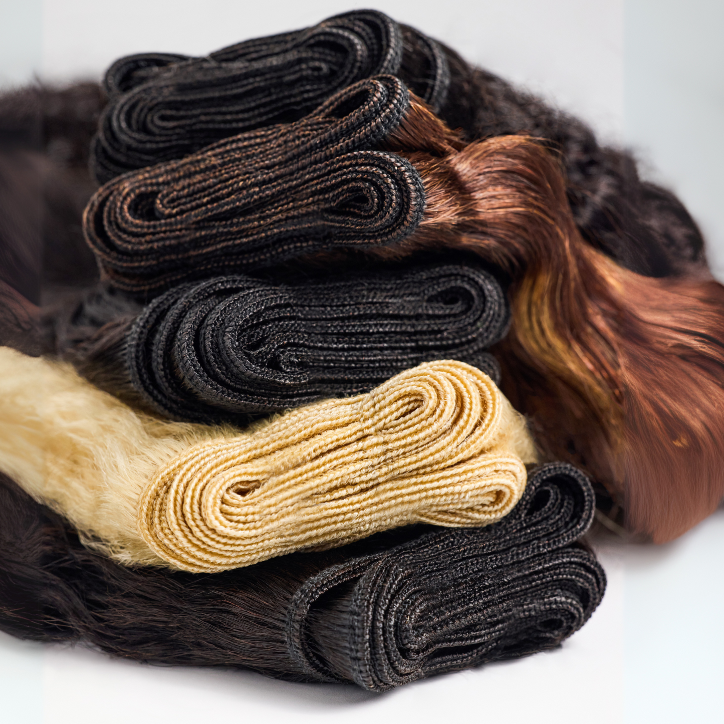 Miix Mii Hair Co.'s weft collection that features machine made wefts for natural hair in the shades natural, 613, and #33.